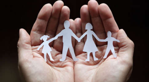 Stock Image of Hand Holding Paper Cutouts